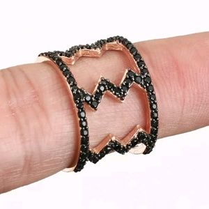 Black onyx & rose gold lightening barrel ring
